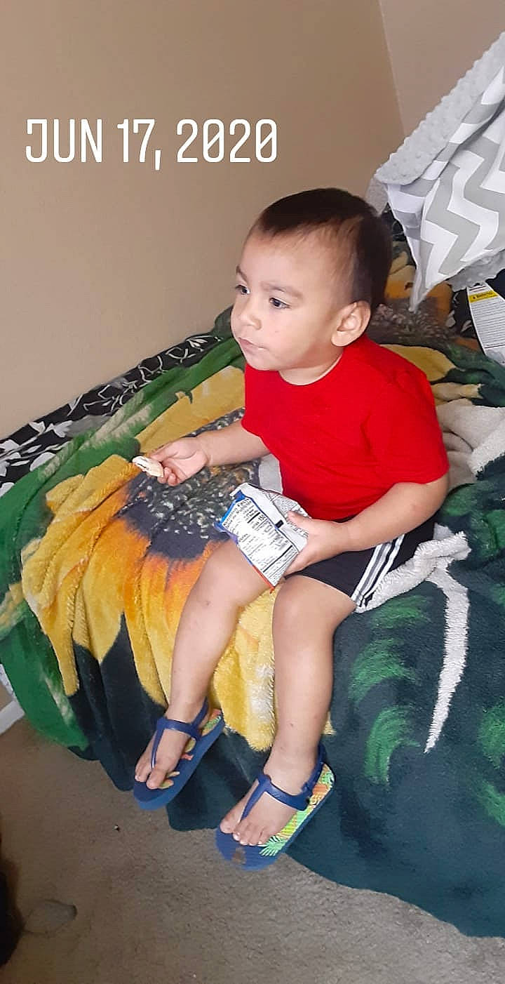 Gilberto joined the competition — help win amazing prizes! ankle, baby, baby_toddler_clothing, book, child, curious, ear, foot, hand, human_body, lap, living_room, nail, person, play, sandal, sitting, slipper, sock, toe