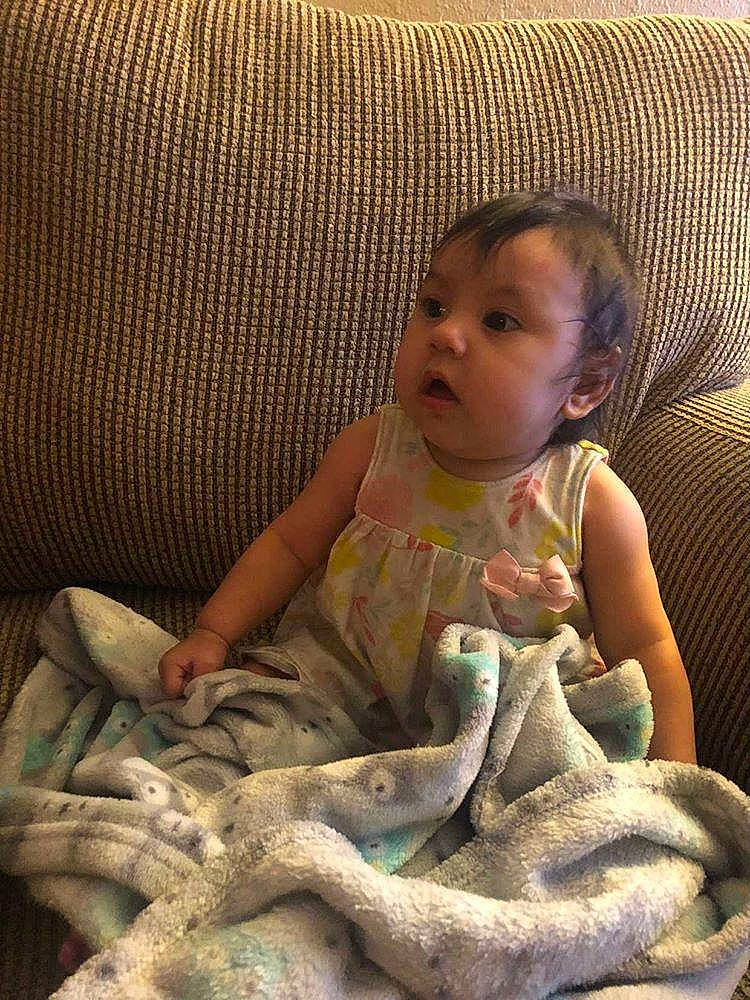 Amara joined the competition — help win amazing prizes! armrest, baby, baby_toddler_clothing, child, comfort, couch, human, linens, natural_material, person, slipcover, surprise, throw_pillow