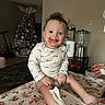 Jonah is registered to the contest to win money with this photo: baby, blanket, blender, child, chocolate, christmas_tree, cute, face, floral_pattern, food, hands, happy, holiday, indoor, kitchen, messy, person, sitting, smiling, table