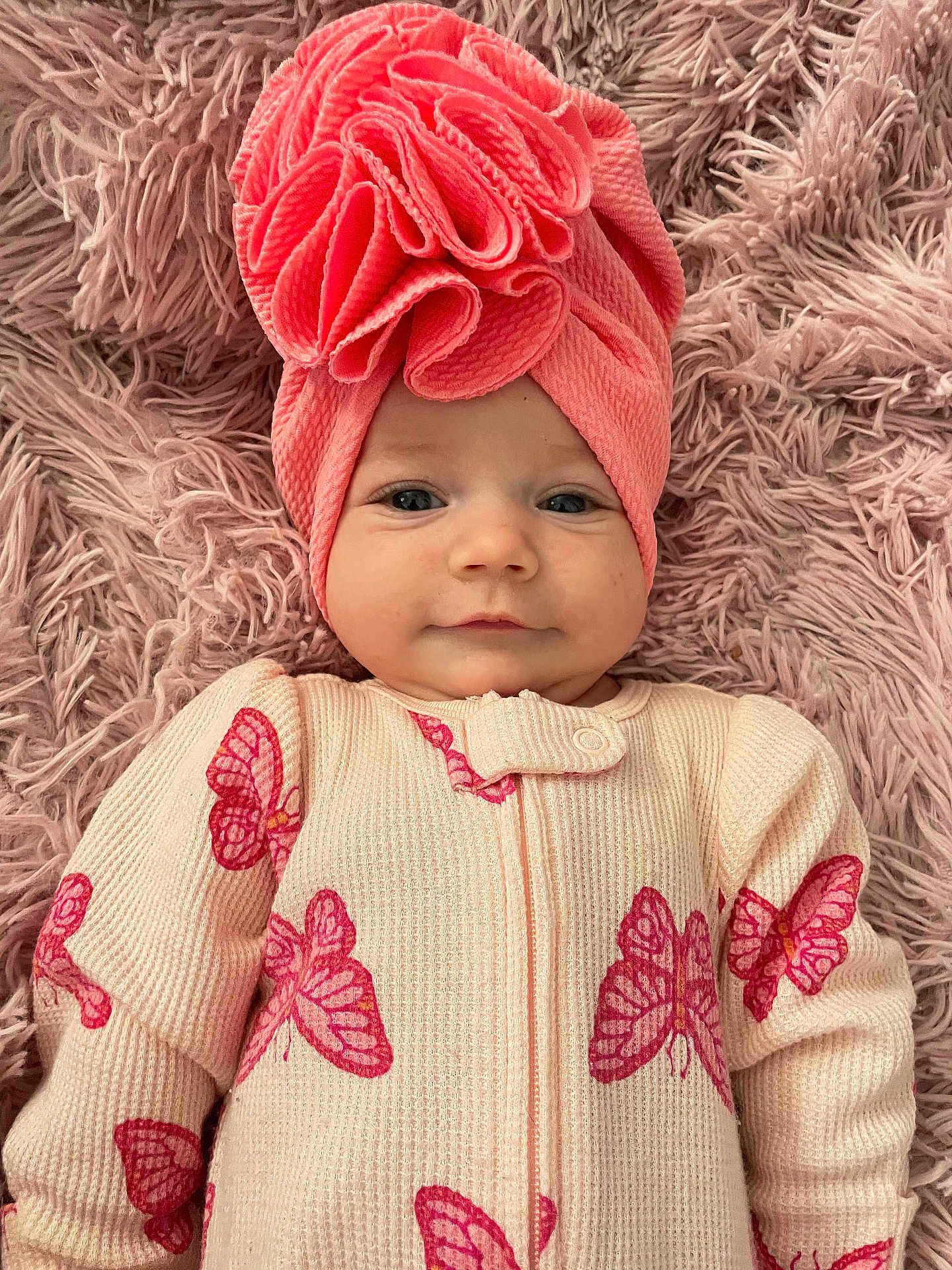 Mariana joined the competition — help win amazing prizes! baby, infant, pink_turban, butterfly_pattern, onesie, blanket, fluffy_texture, cute, smiling, portrait, child, cozy, soft, headwear, lying_down, closeup, skin, eyes, happy, fashion