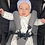 Mariana joined the competition — help win amazing prizes! baby, infant, stroller, onesie, hat, harness, straps, child, seat, padded, patterned_clothing, face, blue_eyes, outdoor, baby_garment, baby_fashion, cute, baby_accessory, portrait, calm