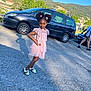 alloywheel, car, carwheel, child, clothing, dress, face, female, girl, head, machine, person, photography, portrait, spoke, suv, tire, transportation, vehicle, wheel