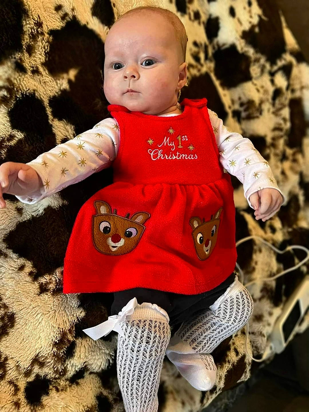 Adelynn is registered to the contest to win money with this photo: baby, baby_toddler_clothing, cheek, child, doll, eye, fawn, grass, happy, head, headgear, pattern, person, sitting, skin, sleeve, t_shirt, toddler, toy, wood