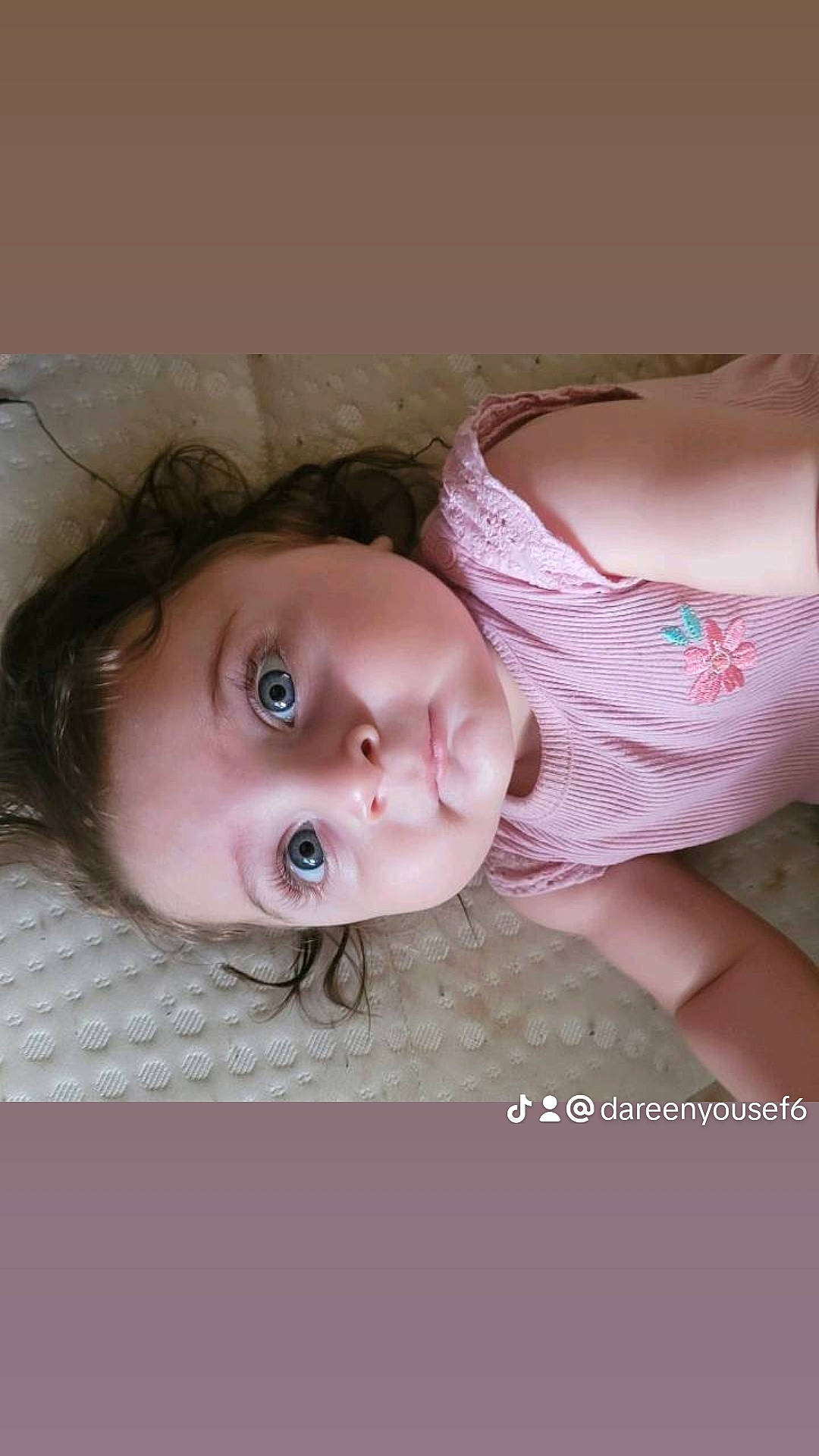 Dareen is registered to the contest to win money with this photo: baby, baby_toddler_clothing, cheek, child, comfort, dress, eye, eyebrow, eyelash, fur, hair, human_body, iris, lip, nose, pattern, person, skin, sleeve, toddler