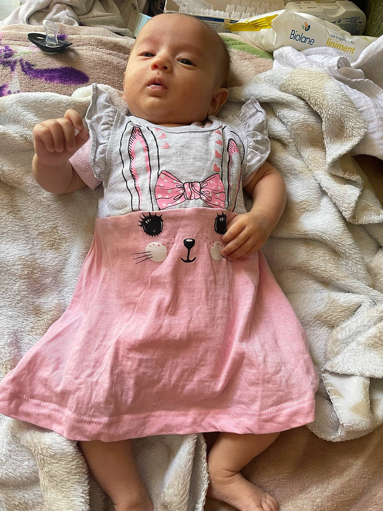 Azélya participe au concours pour gagner de l'argent avec cette photo : baby, baby_toddler_clothing, cheek, day_dress, doll, dress, eye, eyelash, head, human_body, one_piece_garment, pattern, peach, person, pink, skin, sleeve, textile, toddler, toy