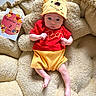 baby, child, colorful, comfortable, cushion, cute, expression, hat, headwear, indoors, infant, lying_down, milestone_card, plush, pooh, portrait, red_clothing, soft_texture, winnie_the_pooh, yellow_clothing