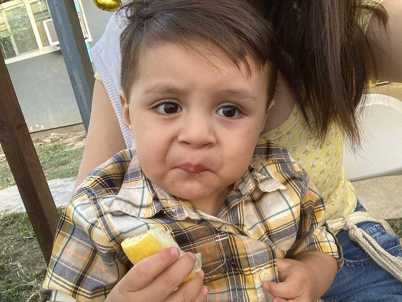 Jared is registered to the contest to win money with this photo: cheek, child, ear, eyelash, facial_expression, finger, fun, hand, happy, iris, lip, mouth, nose, person, photograph, plaid, sharing, skin, tartan, toddler