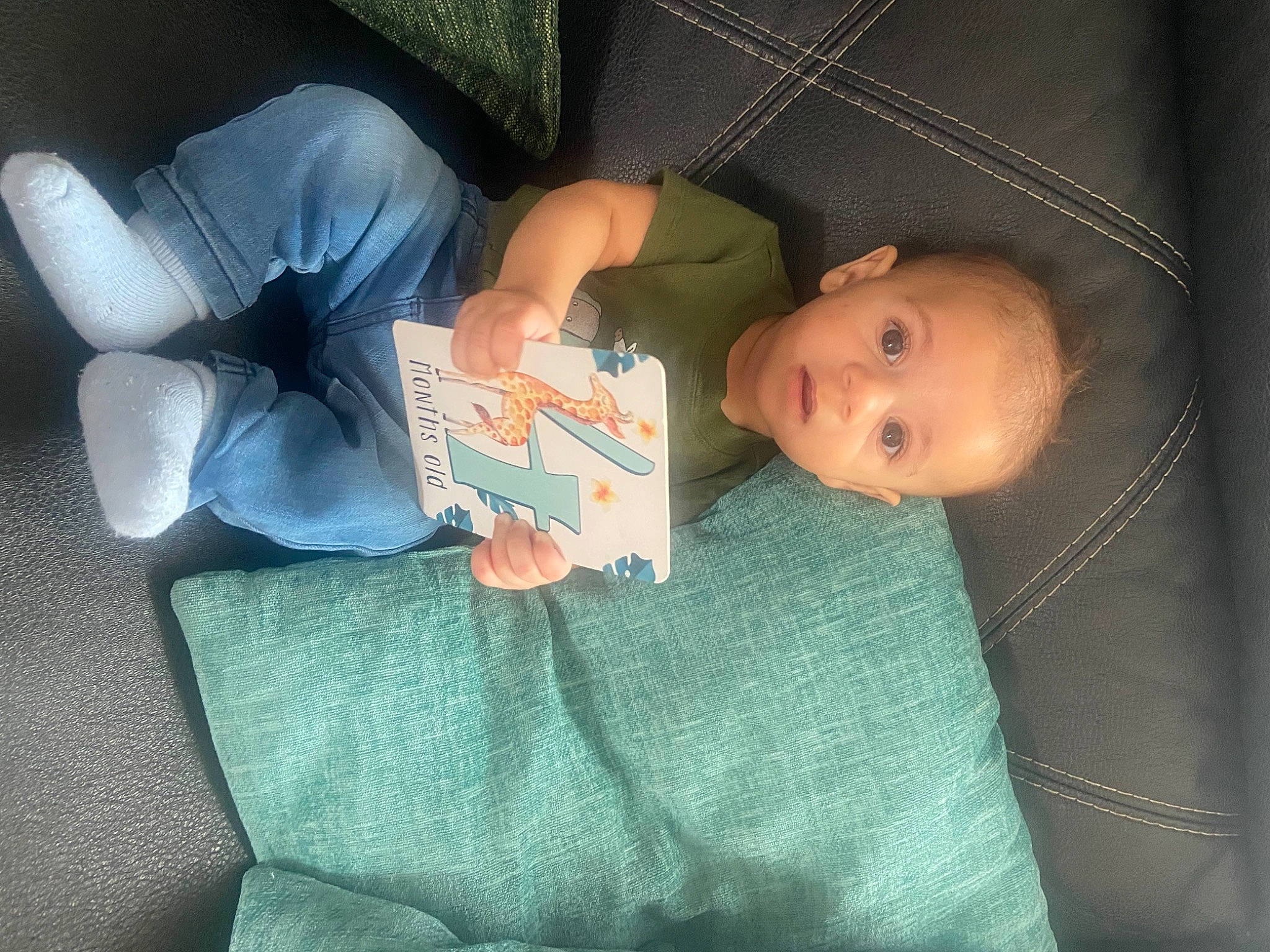 Desmond is registered to the contest to win money with this photo: baby, baby_products, baby_toddler_clothing, bedtime, car_seat, child, comfort, human_body, human_leg, knee, lap, linens, nail, nap, person, room, sitting, sleep, thigh, toddler