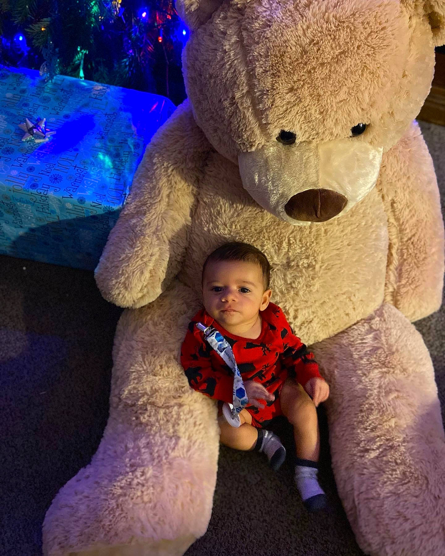 Desmond is registered to the contest to win money with this photo: art, baby, baby_toddler_clothing, child, eye, fawn, fun, happy, head, human_body, light, lighting, nose, person, photograph, snapshot, stuffed_toy, teddy_bear, toddler, toy