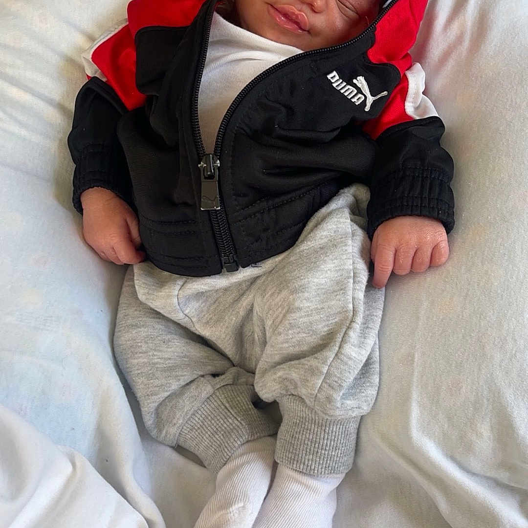 Kairo joined the competition — help win amazing prizes! baby, bed, bedroom, blanket, clothing, coat, couch, cushion, face, furniture, glove, head, homedecor, jacket, newborn, pants, person, photography, portrait, sleeping