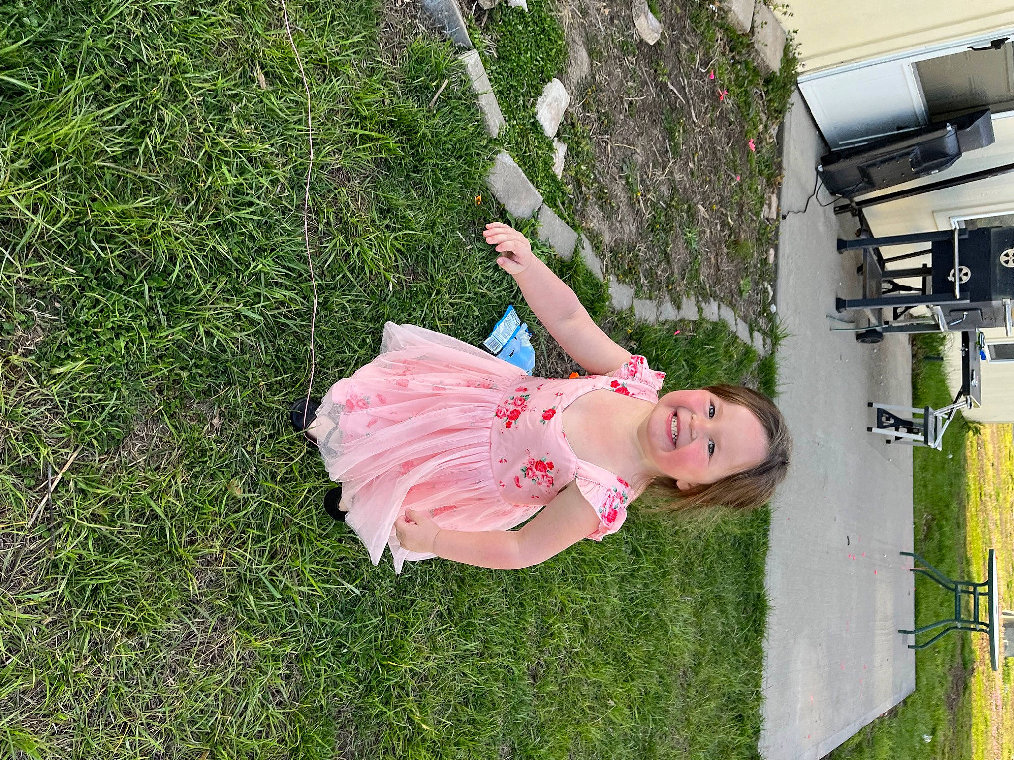 Pearl is registered to the contest to win money with this photo: fun, garden, grass, grass_family, grassland, happy, joy, lawn, leisure, magenta, people_in_nature, person, plant, recreation, sandal, shrub, yard