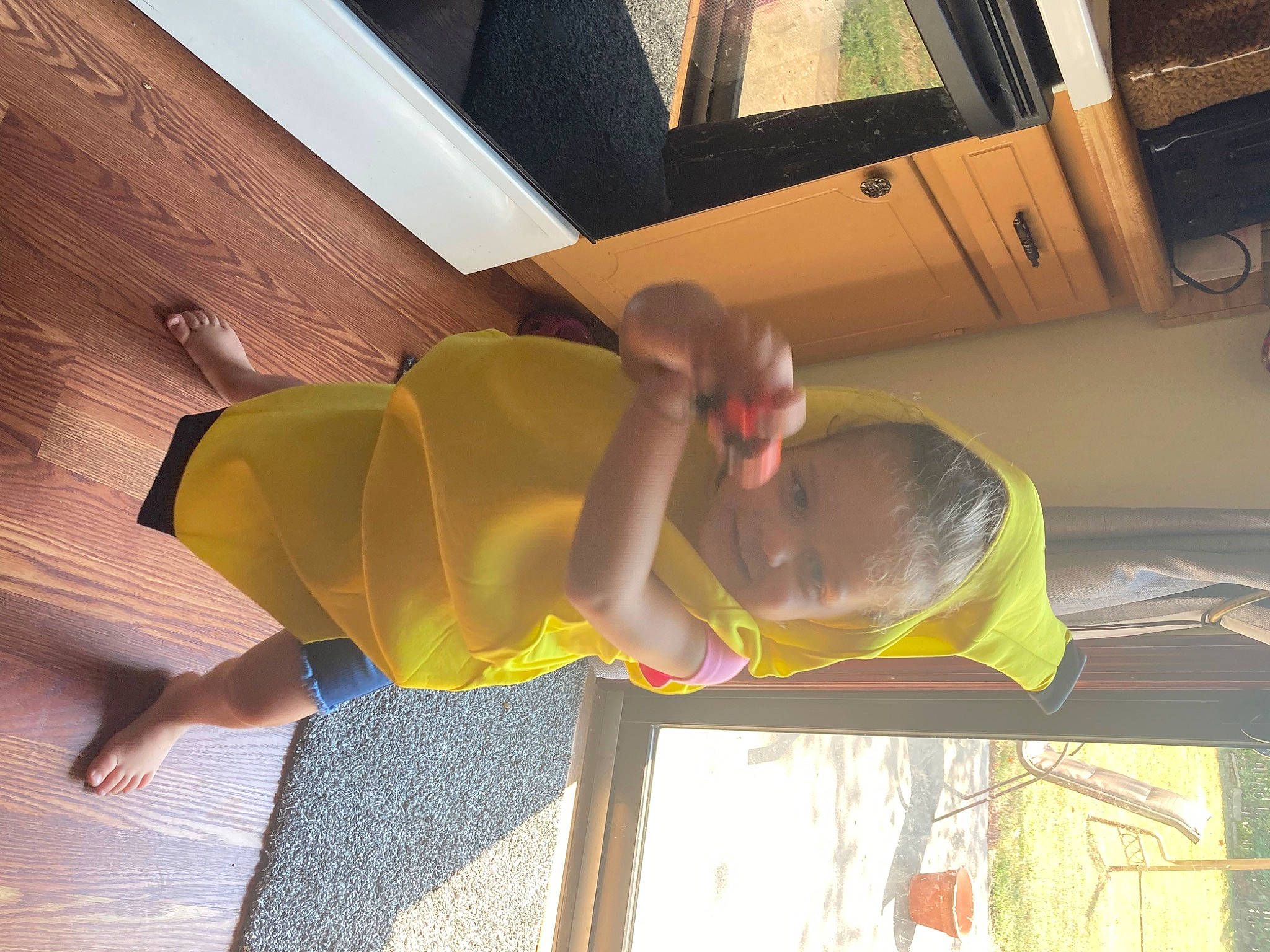 Hope is registered to the contest to win money with this photo: ceiling, comfort, elbow, flooring, foot, fun, hardwood, human_leg, knee, leisure, person, room, thigh, tints_and_shades, window, wood