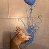 animal, blue_yarn, cat, curious, cute, entangled, fur, indoor, kitten, looking_up, orange_tabby, paws, pet, playful, small, tiled_floor, toy, whiskers, yarn, young