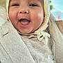 Beatrice participe au concours pour gagner de l'argent avec cette photo : baby, infant, child, smile, happy, bonnet, headscarf, face, cheeks, mouth_open, tongue, teeth, portrait, closeup, clothing, coat, fabric, cozy, indoors, cute