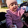 baby, beanie, building, cheeks, child, cute, earring, flowers, hand, infant, outdoor, pink_fleece, pink_hat, portrait, seat, shoe, smile, spring, stroller, sunlight