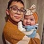 Eduard a rejoint le concours — aidez-le/la à gagner de superbes lots ! child, baby, sibling, glasses, headband, bow, sweater, knit_sweater, denim, smile, dimple, portrait, indoor, curtain, hug, warm_colors, family, cheerful, close_up, happy