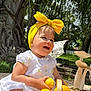 Mis Bas is registered to the contest to win money with this photo: baby, basket, child, cute, fruit, garden, greenery, happy, headband, lemon, nature, outdoor, playful, sitting, smiling, summer, sunlight, tree, white_dress, yellow_headband