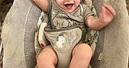 Rhyatt joined the competition — help win amazing prizes! baby, smiling, rocker, infant, happy, arms_up, seated, clothing, patterned_fabric, indoor, cushion, cute, child, face, footwear_none, playful, home, young_child, baby_girl_or_boy, soft_toys