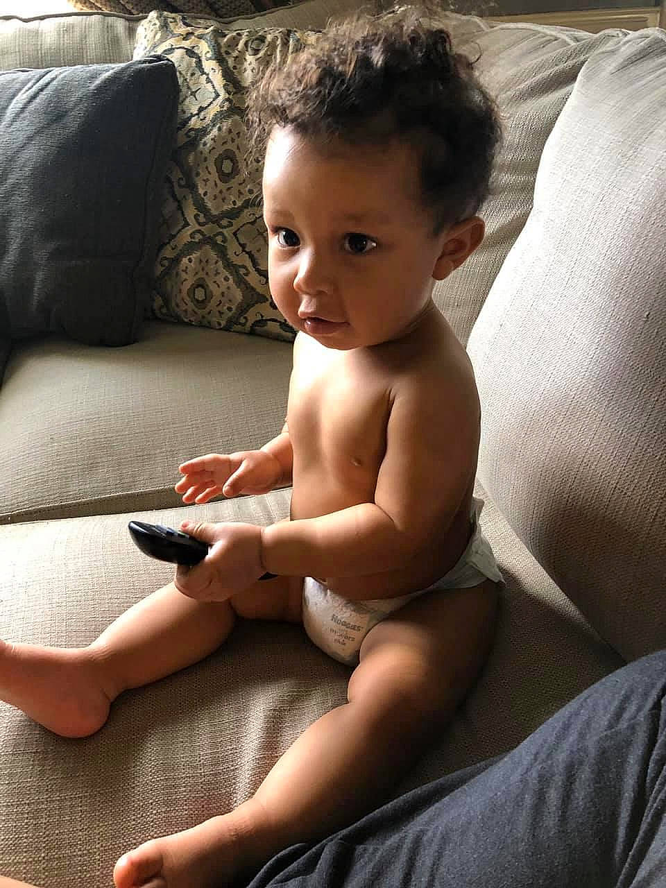 Jakobe is registered to the contest to win money with this photo: abdomen, arm, baby, barechested, chest, child, elbow, electronic_device, finger, gadget, hand, human_leg, leg, muscle, person, sitting, skin, technology, toddler, trunk