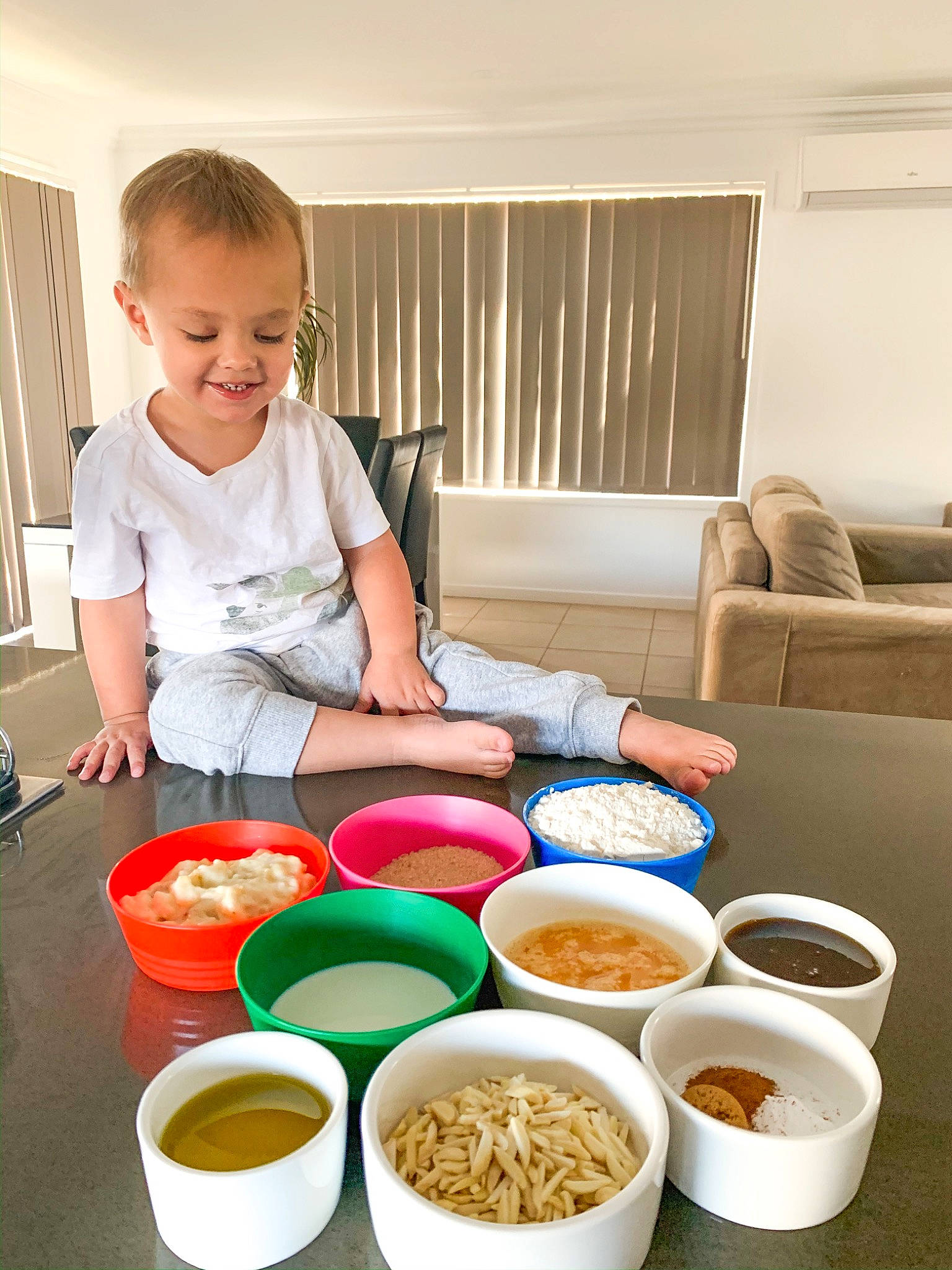 Hudson is registered to the contest to win money with this photo: baby_food, bowl, breakfast, brunch, child, comfort_food, cuisine, dish, eating, food, joy, lunch, meal, person, play, toddler, vegetarian_food