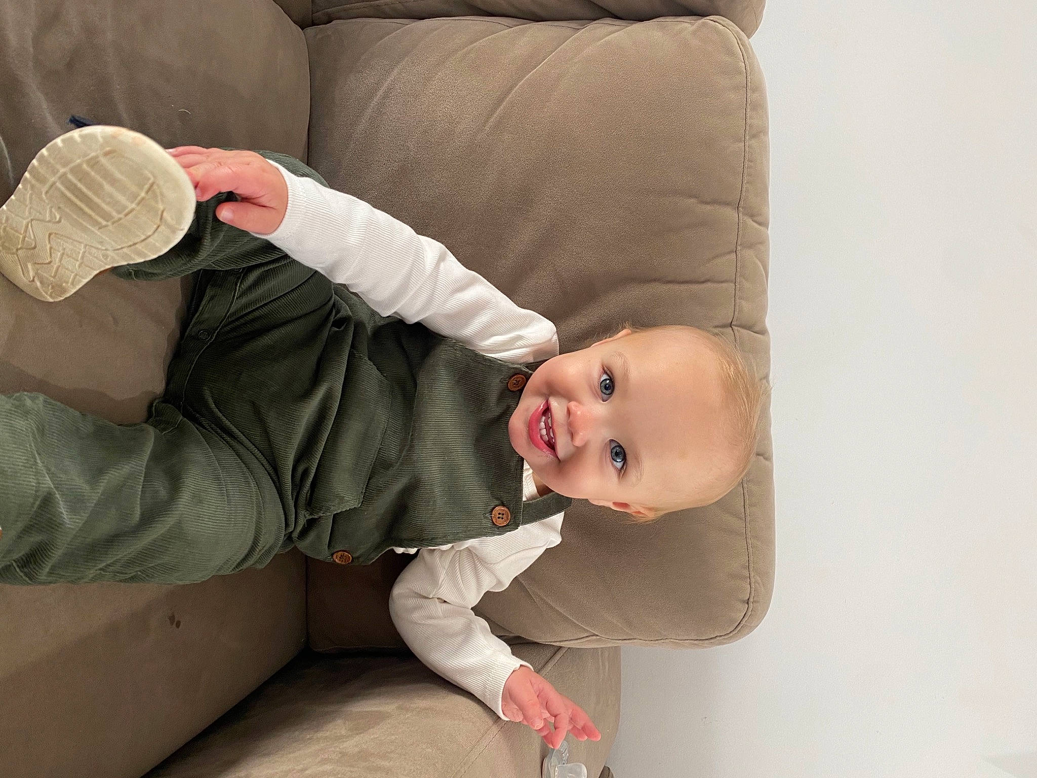 Boston is registered to the contest to win money with this photo: arm, baby, baby_toddler_clothing, comfort, finger, flash_photography, gesture, hair, hand, happy, head, headgear, human_body, joy, leg, mouth, neck, nose, person, sleeve