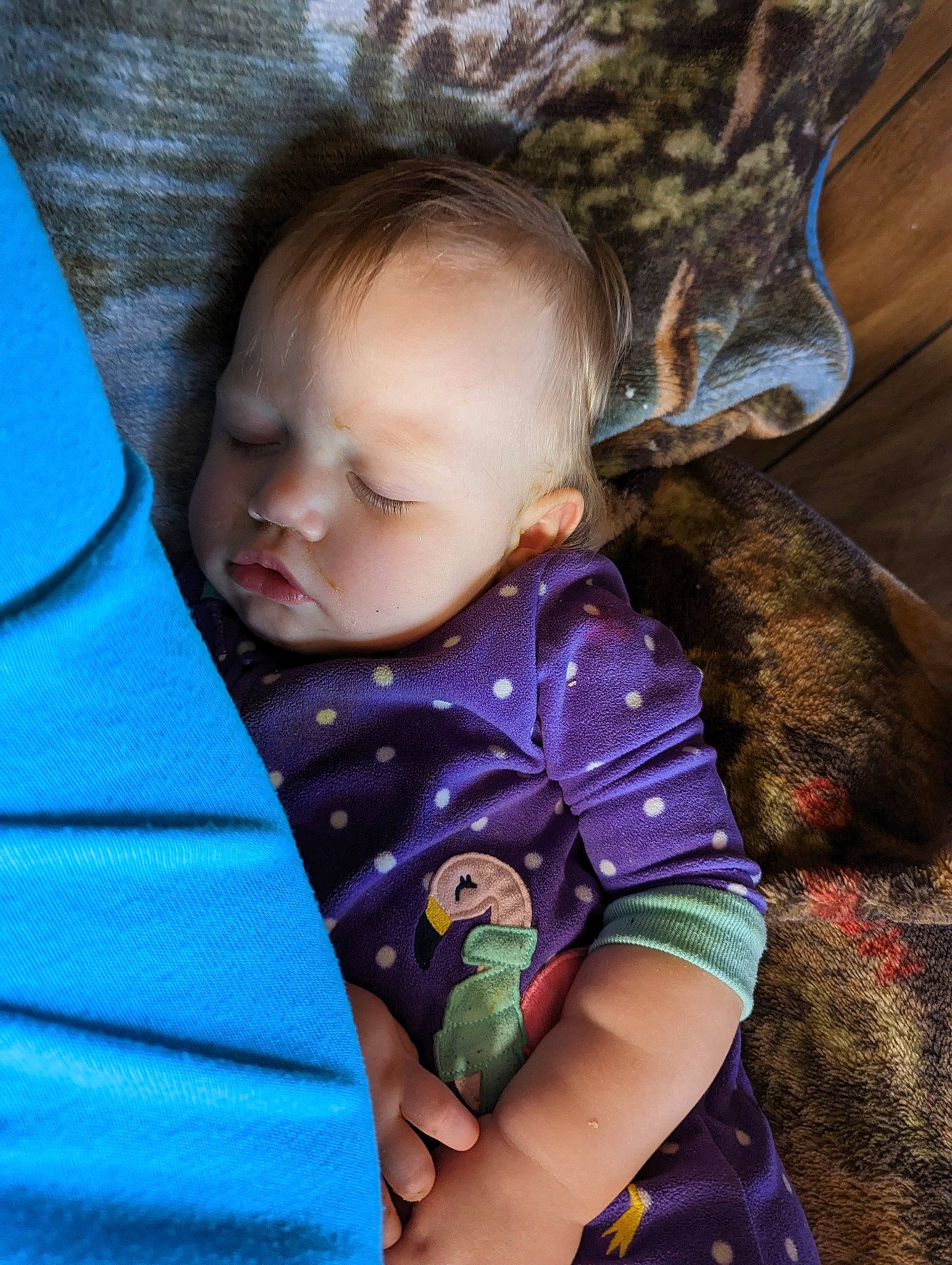 Davina is registered to the contest to win money with this photo: baby, baby_products, baby_toddler_clothing, cheek, child, comfort, cool, electric_blue, fur, grass, iris, lap, linens, nose, pattern, person, sitting, skin, sleeve, toddler