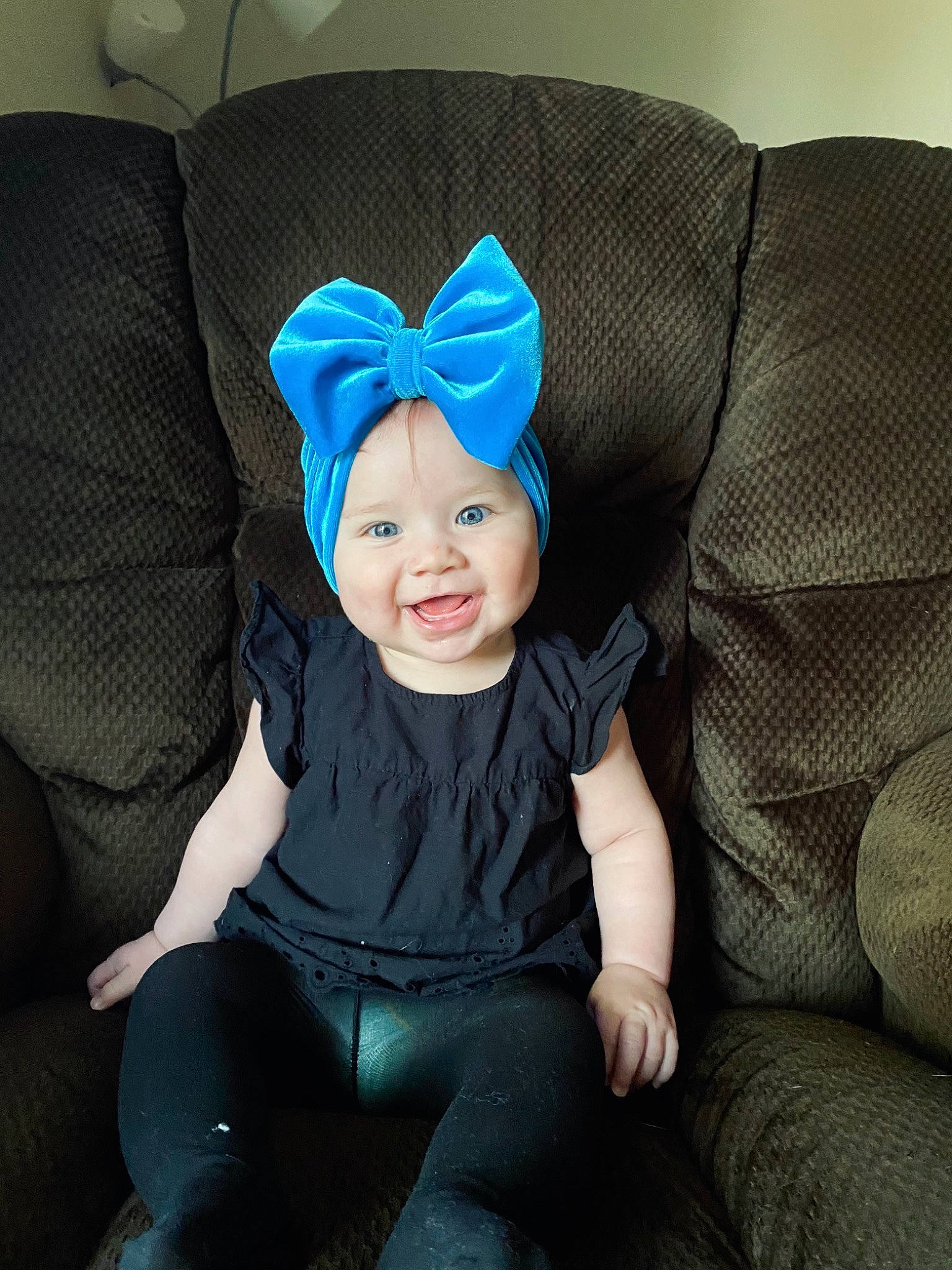 Aspyn is registered to the contest to win money with this photo: baby, baby_toddler_clothing, cap, child, comfort, costume_hat, couch, electric_blue, fashion_accessory, finger, fun, happy, headgear, headwear, magenta, person, personal_protective_equipment, sitting, sleeve, smile