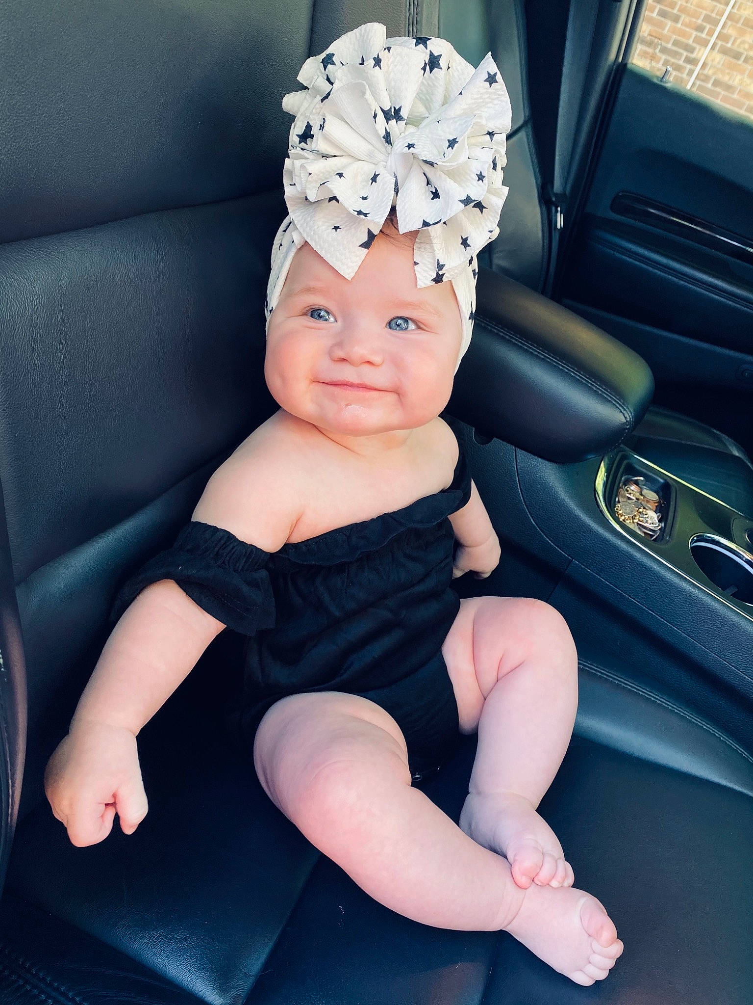 Aspyn is registered to the contest to win money with this photo: automotive_design, automotive_lighting, baby, baby_toddler_clothing, cap, car, car_seat, dress, finger, flash_photography, hair, happy, headgear, headwear, human_body, person, steering_wheel, thigh, thumb, toddler