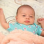 Era Viella is registered to the contest to win money with this photo: baby, bed, blanket, blue_onesie, child, cozy, cute, face, floral_pattern, hand, indoor, infant, lying_down, newborn, peaceful, person, resting, skin, sleepy, soft_texture