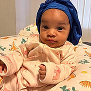 Melsandra joined the competition — help win amazing prizes! baby, baby_bed, blue_bonnet, cactus_pattern, child, clothing, cozy, cushion, cute, dinosaur_pattern, elephant_print, face, hand, indoor, infant, person, pink_onesie, portrait, relaxing, soft_light