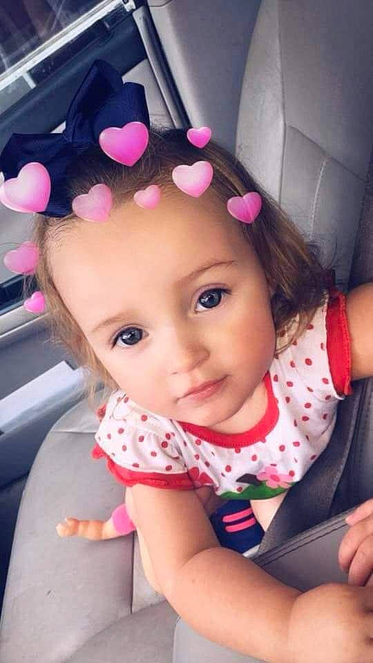 Zaiya is registered to the contest to win money with this photo: auto_part, baby, black_hair, car_seat, cheek, child, design, pattern, person, pink, polka_dot, product, toddler