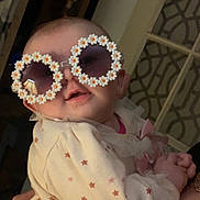 Paisley is registered to the contest to win money with this photo: accessories, baby, bodypart, bonnet, clothing, coat, costume, face, finger, glasses, hand, hat, head, jacket, jewelry, newborn, person, photography, portrait, sunglasses
