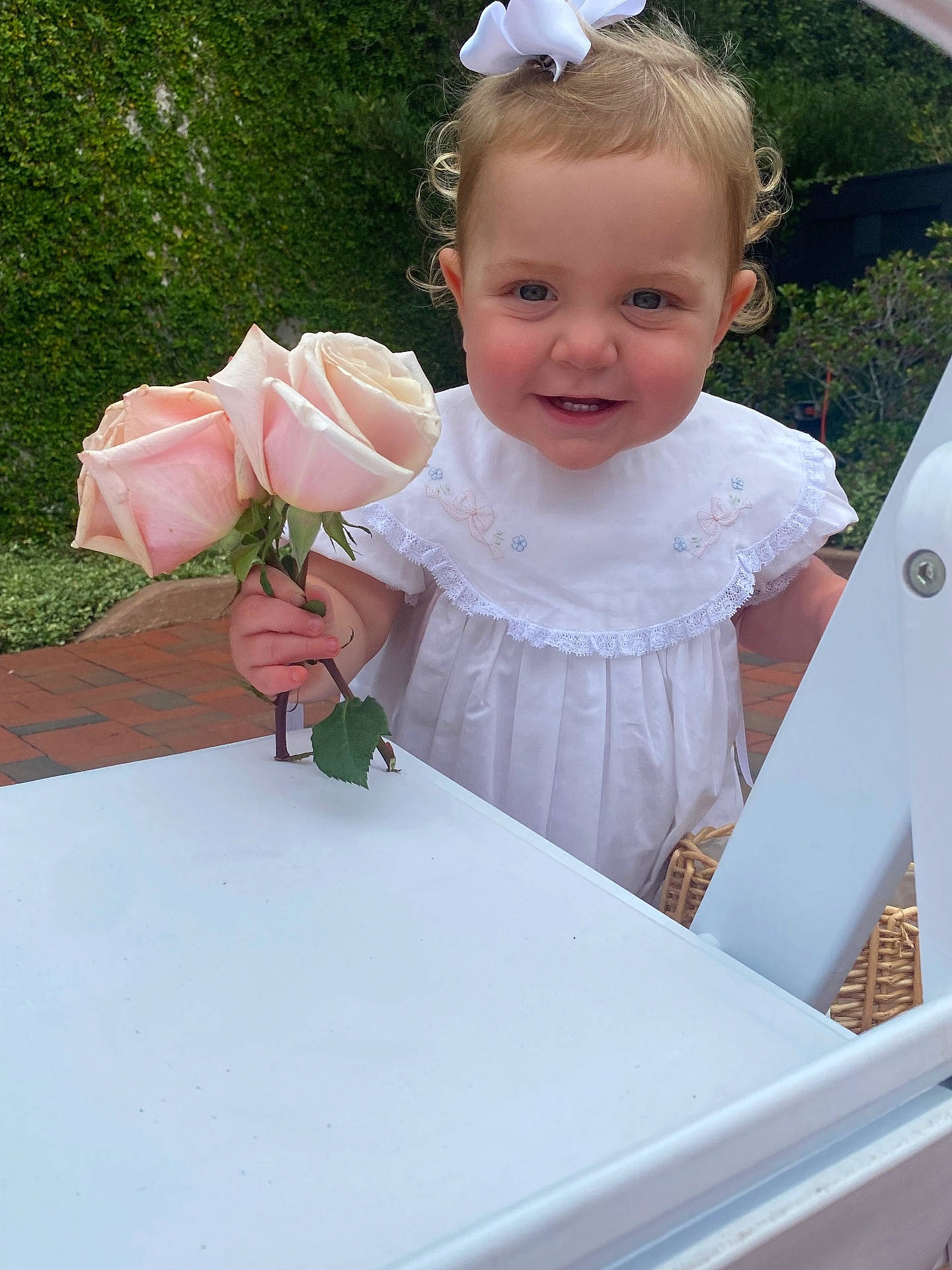 Olivia joined the competition — help win amazing prizes! anemone, baby, clothing, cream, dessert, dress, face, flower, flowerarrangement, flowerbouquet, grass, head, leaf, person, petal, photography, plant, portrait, pottedplant, rose