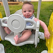 Oliver joined the competition — help win amazing prizes! baby, swing, outdoor, grass, playground, child, smiling, happy, plastic, seat, feet, hand, daylight, toy, fun, summer, cute, infant, play, nature