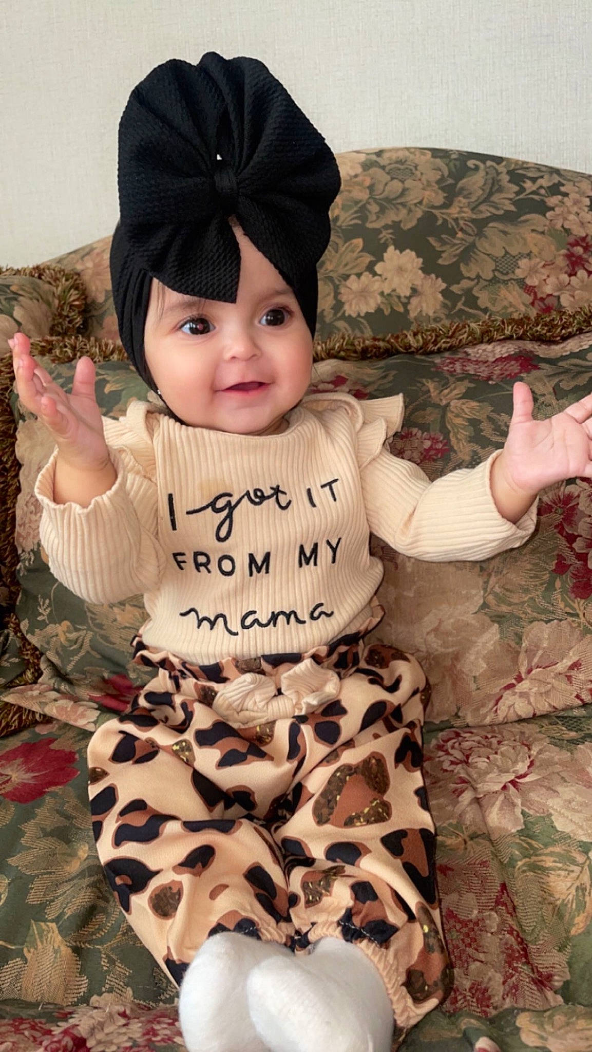 Adelina joined the competition — help win amazing prizes! baby, baby_toddler_clothing, cap, child, fashion_accessory, font, fur, happy, headgear, headwear, human_body, knit_cap, organ, outerwear, pattern, person, pink, sitting, skin, sleeve