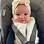 baby, infant, child, car_seat, head_wrap, vest, smile, face, clothing, straps, safety, cute, closeup, indoors, portrait, seat, baby_fashion, happy, person, soft_texture