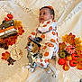 acorns, autumn_leaves, baby, blanket, blessed, child, cozy, cute, decorative_blocks, dog_figurine, fall_decor, festive, grateful, mini_pumpkins, orange, portrait, pumpkin_onesie, thankful, toy, white