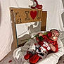 Bodoquito is registered to the contest to win money with this photo: baby, infant, child, pacifier, rose, red_booties, heart, cardboard_sign, handmade_sign, valentines, blanket, white_background, props, lipstick_kiss, cardboard, shadow, sitting, cute, portrait, red_shirt