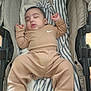 Bodoquito joined the competition — help win amazing prizes! baby, infant, newborn, sleeping, stroller, blanket, striped_blanket, cozy, tan_outfit, nike_logo, drooling, peaceful, portrait, cute, pajamas, head, hands, legs, soft_fabric, indoor