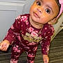 Willa-Jah is registered to the contest to win money with this photo: toddler, child, pink_bow, floral_outfit, slippers, carpet, indoors, curious, standing, big_eyes, maroon, baby, headband, cute, looking_up, young_child, person, floor, portrait, clothing