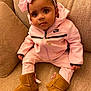 Willa-Jah is registered to the contest to win money with this photo: toddler, child, pink_tracksuit, nike, boots, headband, bow, necklace, curly_hair, couch, indoor, portrait, sitting, brown_boots, baby, cute, fashion, casual_clothing, furniture, cozy