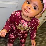 Willa-Jah joined the competition — help win amazing prizes! toddler, child, pink_bow, floral_outfit, slippers, carpet, indoors, curious, standing, big_eyes, maroon, baby, headband, cute, looking_up, young_child, person, floor, portrait, clothing