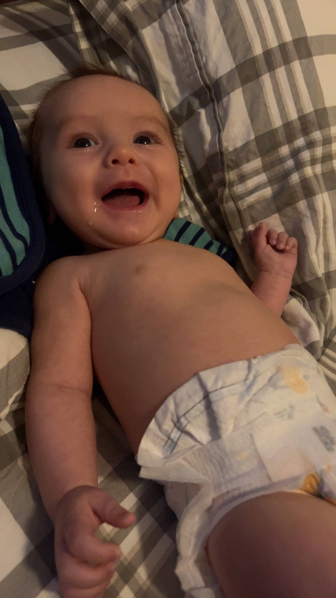 Everette is registered to the contest to win money with this photo: arm, baby, cheek, chest, comfort, eye, finger, gesture, hand, head, headwear, leg, mouth, muscle, person, skin, smile, stomach, textile, thigh