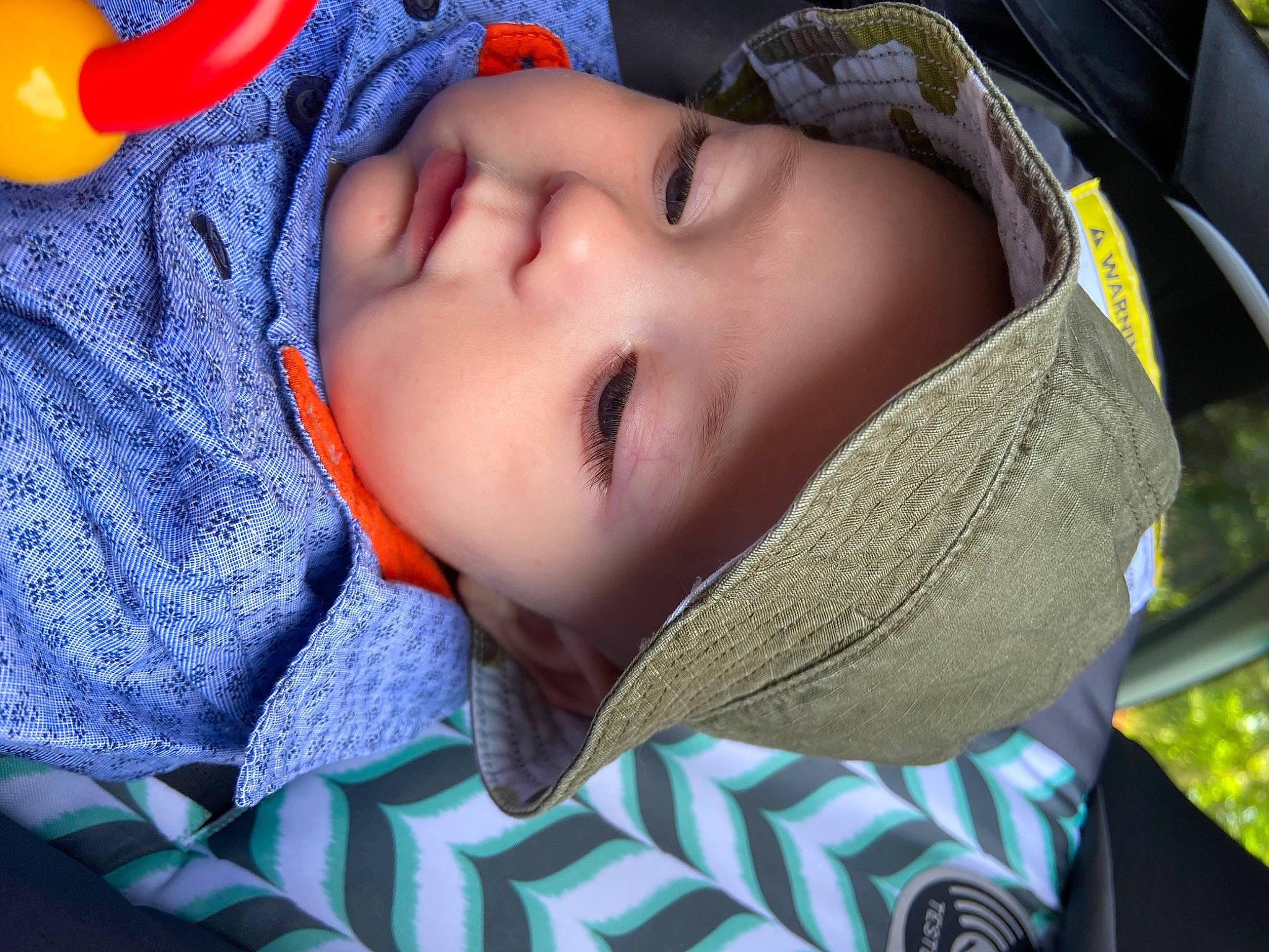 Wolfe is registered to the contest to win money with this photo: baby, baby_products, baby_toddler_clothing, blue, cheek, child, comfort, electric_blue, fun, grass, headgear, headwear, lip, mouth, nose, pattern, person, skin, textile, toddler