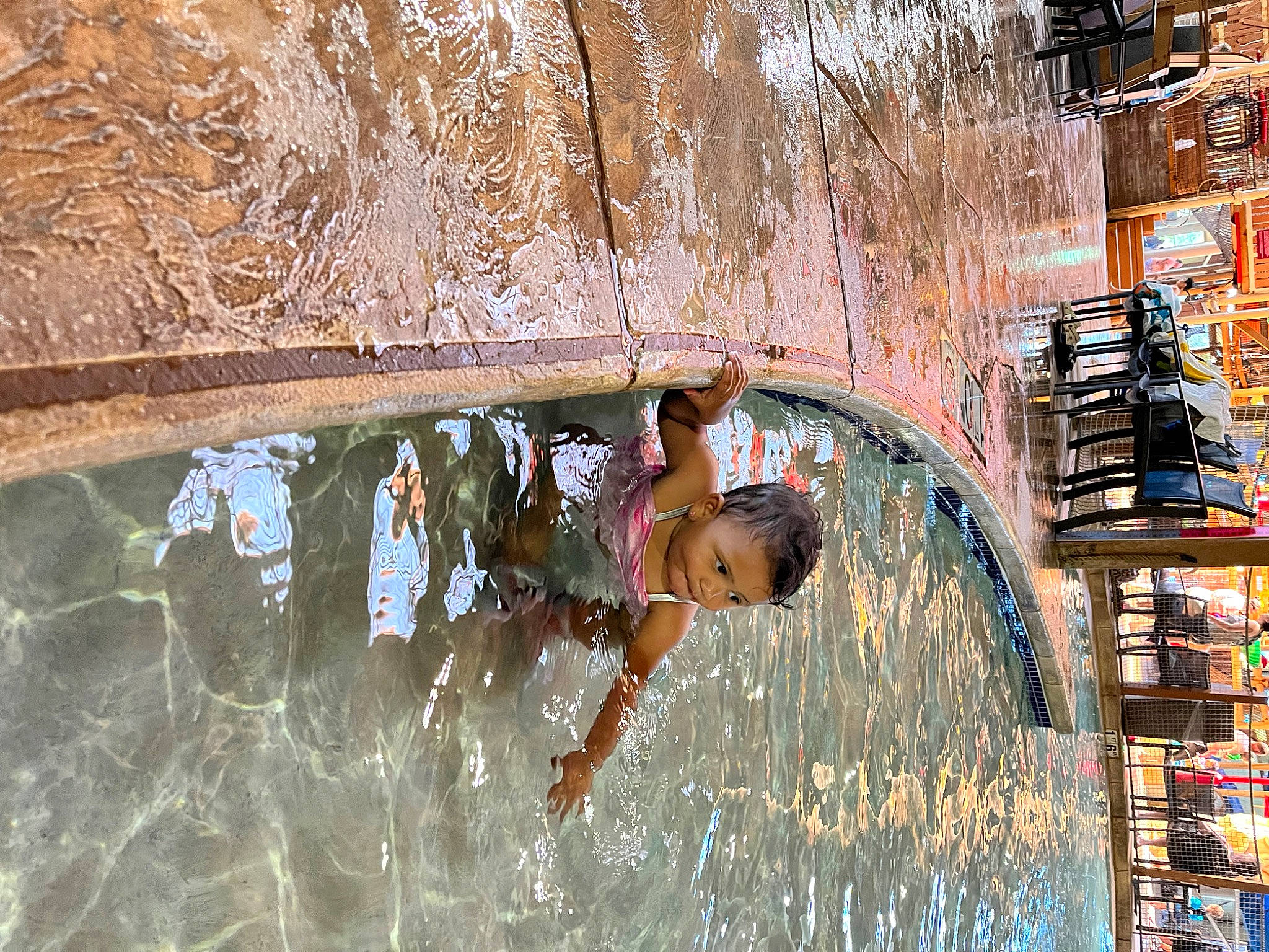 Sariah is registered to the contest to win money with this photo: canal, child, city, facade, freezing, fun, glass, leisure, person, recreation, reflection, soil, street, toddler, tree, visual_arts, water, water_feature, winter, wood