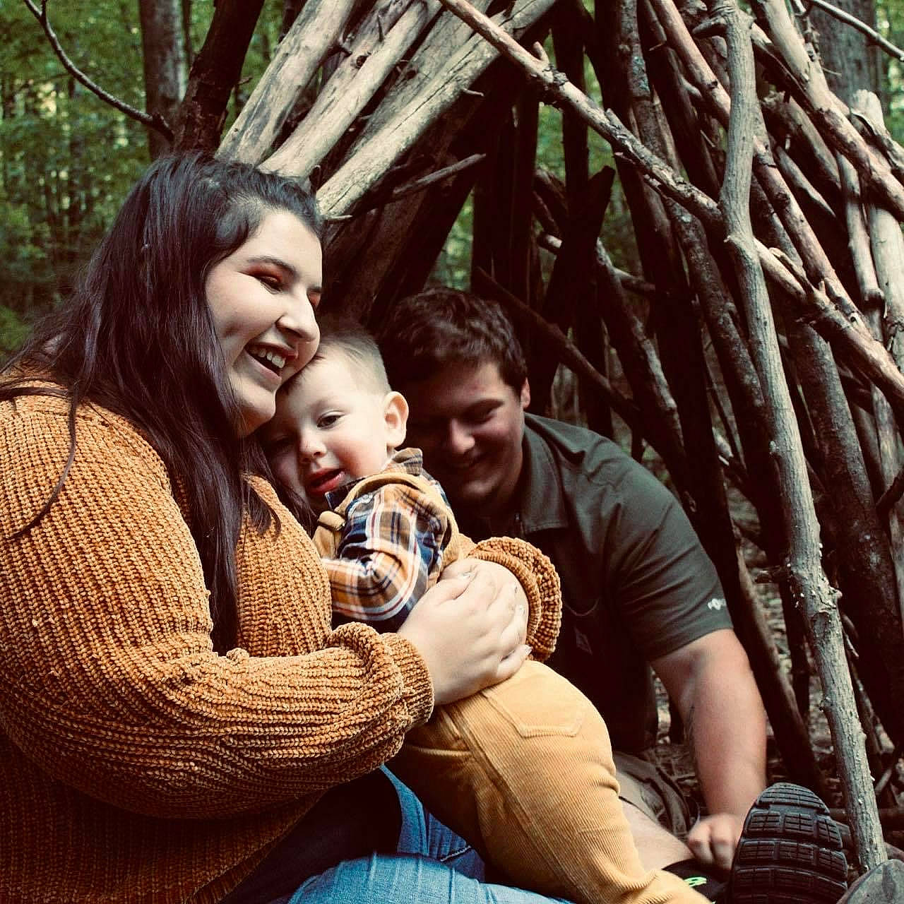 Henri is registered to the contest to win money with this photo: adaptation, arm, branch, comfort, facial_expression, friendship, fun, grass, happy, human, jeans, joy, leisure, people, people_in_nature, person, photograph, plant, smile, tree