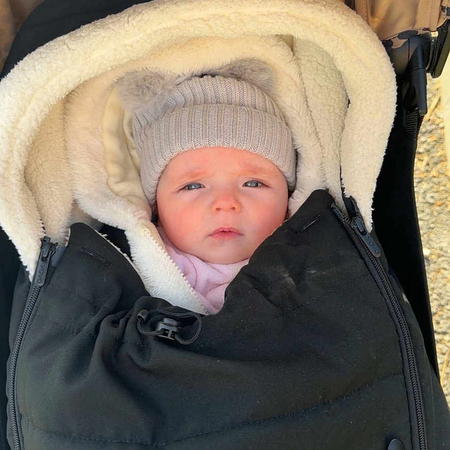 Adriana participe au concours pour gagner de l'argent avec cette photo : baby, beanie, blanket, blue_eyes, bundled, canopy, cozy, cute, fabric, face, hat, infant, outdoor, portrait, pram, rosy_cheeks, stroller, texture, winter_clothing, zipper