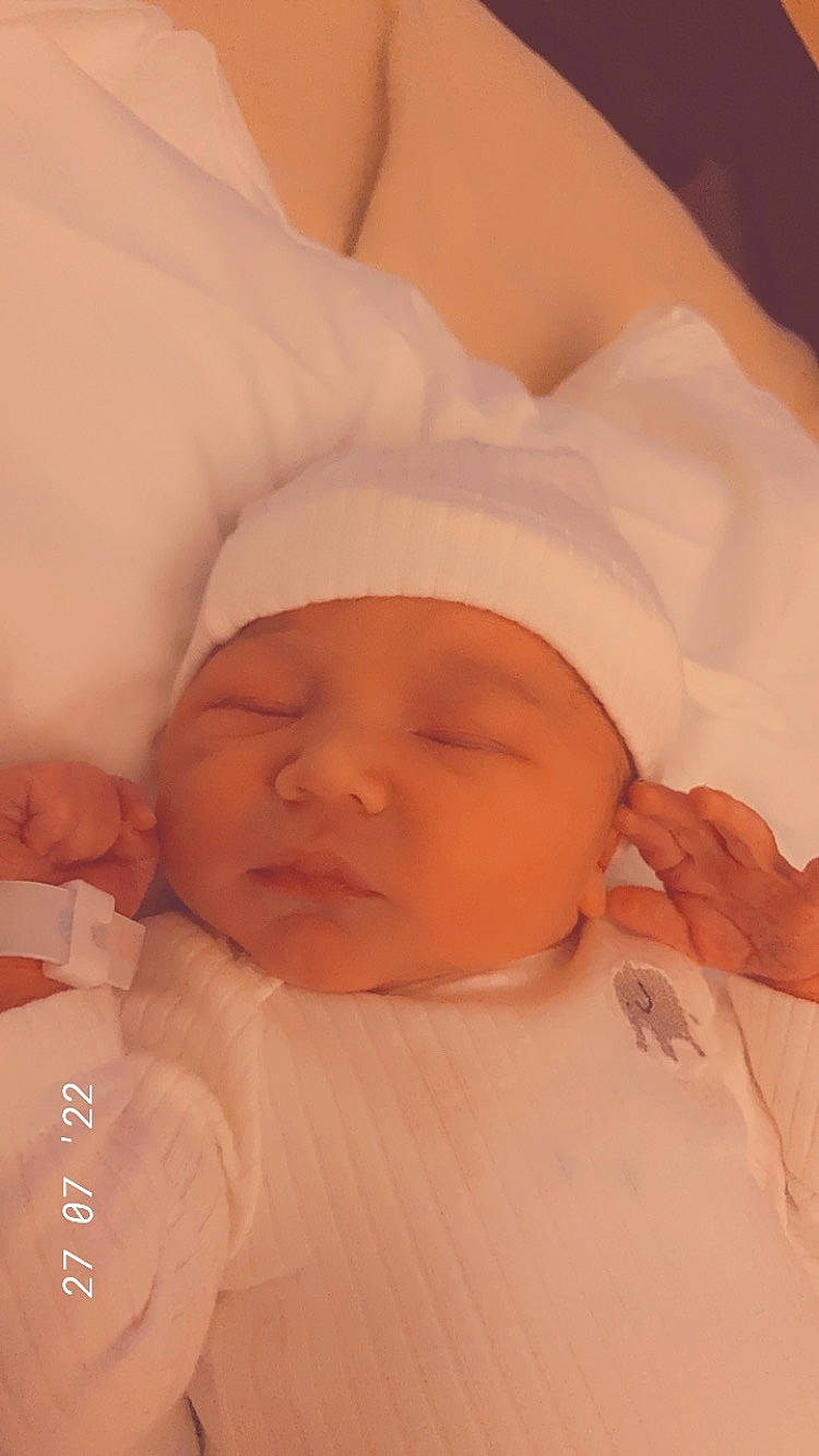 Harrison is registered to the contest to win money with this photo: baby, baby_products, baby_sleeping, baby_toddler_clothing, bedtime, cheek, comfort, event, eyebrow, happy, headwear, linens, lip, mouth, nose, peach, person, pink, skin, sleeve