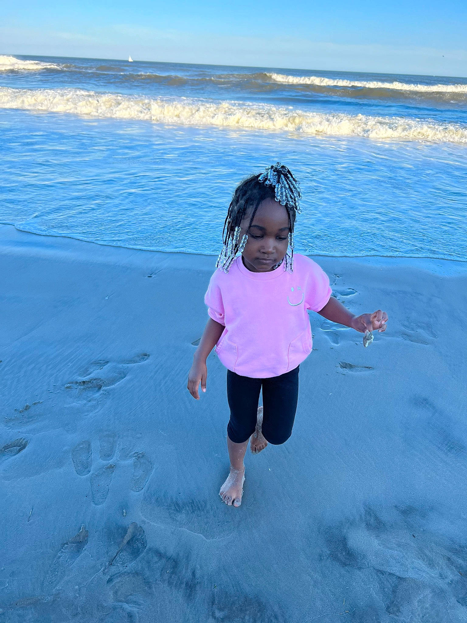 Kennedi is registered to the contest to win money with this photo: aqua, azure, beach, coastal_and_oceanic_landforms, fun, happy, headwear, horizon, landscape, leisure, morning, natural_environment, nature, people_in_nature, people_on_beach, person, sky, summer, sunlight, toddler