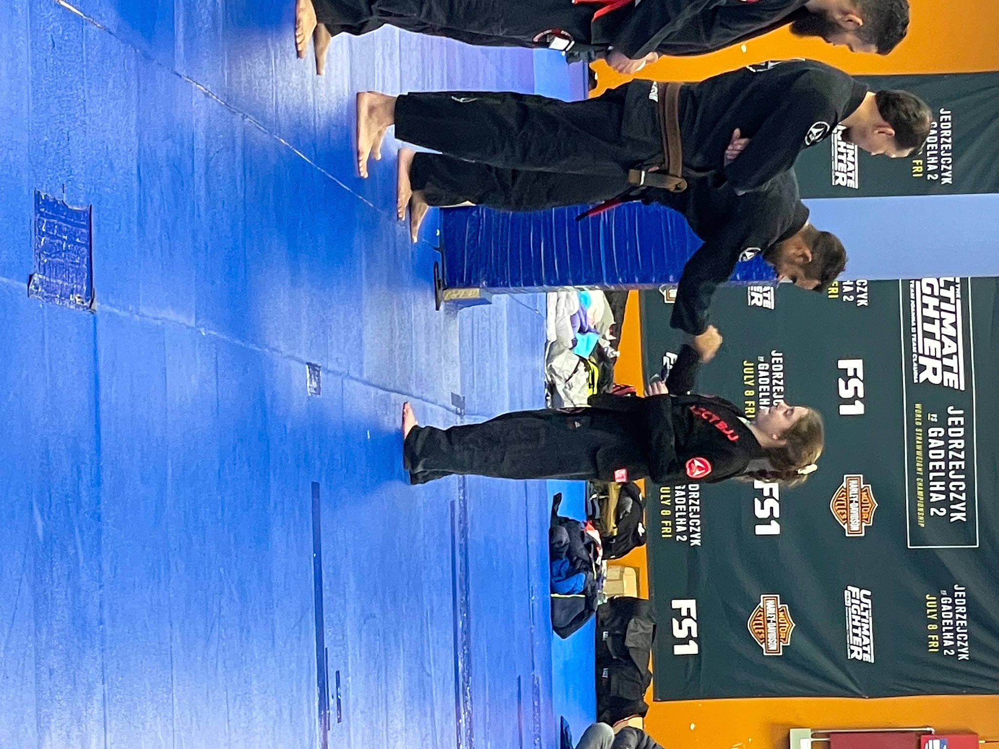 Maddie is registered to the contest to win money with this photo: blue, championship, competition, competition_event, elbow, electric_blue, entertainment, event, person, player, recreation, sports, sports_equipment, sports_uniform, sportswear, stage_equipment, team, tournament, uniform, world